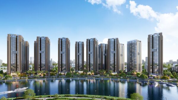 Toàn cảnh dự án căn hộ The Privé với tòa nhà hiện đại và hồ cảnh quan rộng lớn trong khu đô thị xanh mát.